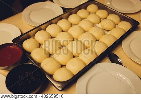 Cooks Prepare A Mini Pizza, Place The Tomato Paste.