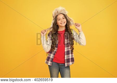 Kid Girl Wear Hat With Ear Flaps. Winter Events At School. Winter Entertainment. Child Carefree Scho