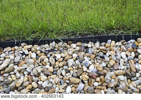 Pebblestones And Green Grass