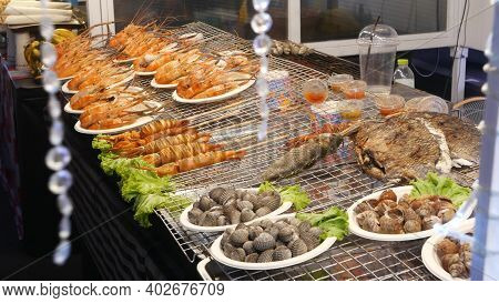 National Asian Exotic Ready To Eat Seafood At Night Street Market Food Court In Thailand. Delicious 