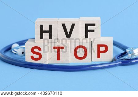 Wooden Block With Words Hvf Stop - With Stethoscope On The Table, Insurance And Medical Concept, Blu