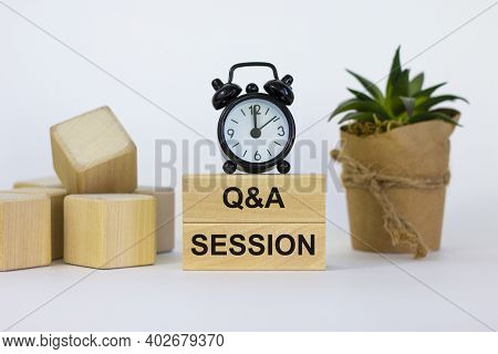 Q And A, Questions And Answers Session Symbol. Concept Words 'q And A Session' On Wooden Blocks On A