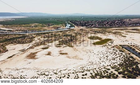 Aerial Drone Shoot From Side Of An Old Lake - White Sands And Plain Background
