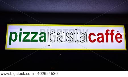 Warsaw, Poland. 10 January 2021. Sign Pizza Pasta Caffe. Company Signboard Pizza Pasta Caffe