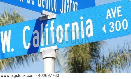 California Street Road Sign On Crossroad. Lettering On Intersection Signpost, Symbol Of Summertime T