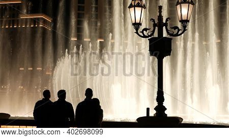 Las Vegas, Nevada Usa - 13 Dec 2019: People Looking At Bellagio Fountain Musical Performance At Nigh