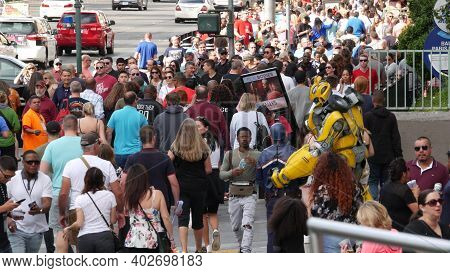 Las Vegas, Nevada Usa - 7 Mar 2020: People On Pedestrian Walkway. Multicultural Men And Women Walkin