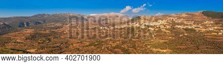 View On Majdal Shams The Druze town in the southern foothills of Mountain Hermon, At Sunset,  Golan Heights, Israel.Snow on Hermon In Background