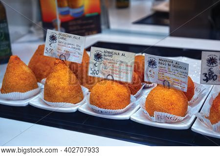 Bergamo, Italy - May 22, 2019: Showcase With Arancini In Bergamo. Arancini Are Italian Snacks Consis