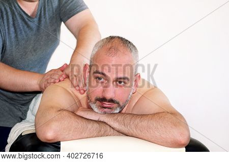 Massage Relax Studio. People Enjoy At Massage Table. Massage Therapist Working With Patient, Massagi