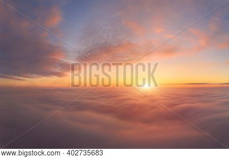 Sunrise Panorama In Lilac And Pale Pink Shades With Cirrus Clouds. Sky Background. View From The Pla