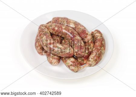 Raw Homemade Pork Sausages, Prepared For Further Grilling On A White Dish On A White Background, Sem