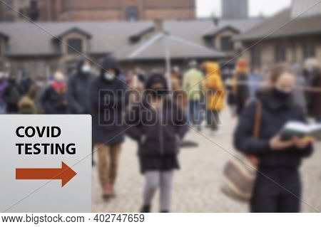 People Waiting In Line Queued Up For Health Screening For Coronavirus Covid-19 Testing Or Vaccine At