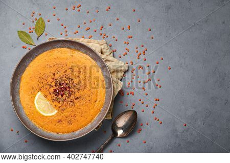 Ezogelin Soup In Gray Bowl On Concrete Table Top. Turkish Cuisine Traditional Dish With Red Lentils,