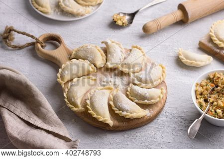 Homemade Raw Frozen Vegan Dumplings, Vareniki, Pierogi, Kreplach  Stuffed With Vegan Lentil 