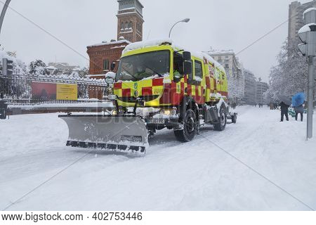 Madrid, Spain - January 09, 2021: Snow Plow Public Service Off-road Vehicle In Emergency, On A Snowy