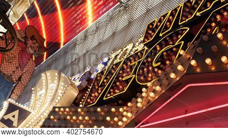 Las Vegas, Nevada Usa - 12 Dec 2019: Cowboy Vegas Vic, Old Neon Sign Glowing, Freemont Street In Sin