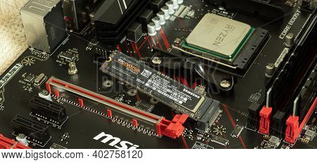 Moscow, Russia - 5 December 2020: Ryzen Cpu In Socket Of Msi Motherboard With Samsung Ssd Memory Clo