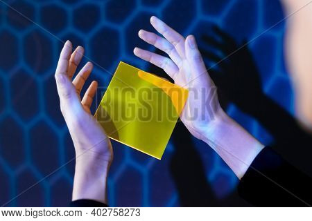 Woman showing yellow interface hologram