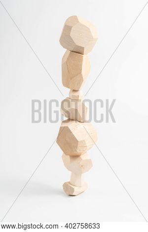 Tumi-ishi Puzzle Game. Stones For Rock Balance. An Unstable Tower Built From Multi-faceted Timber Ba