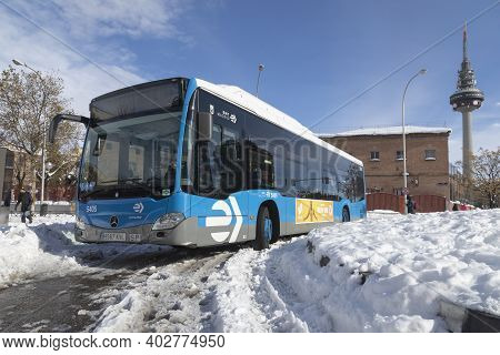 Madrid, Spain - January 10, 2021: Bus Trapped In Snow And Ice In Dr. Esquerdo Street, On A Snowy Day