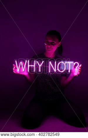 Beautiful Young Girl Holding Pink Neon Sign Why Not?. Trendy Style. Neon Sign. Custom Neon. Home Dec