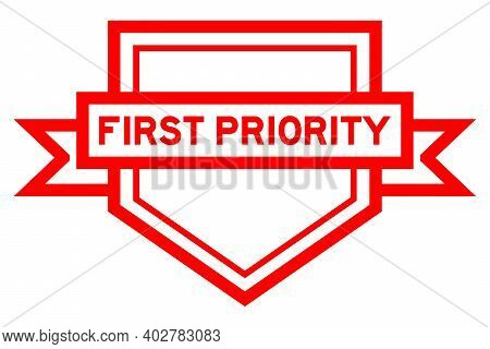 Vintage Pentagon Label Banner With Word First Priority In Red Color On White Background