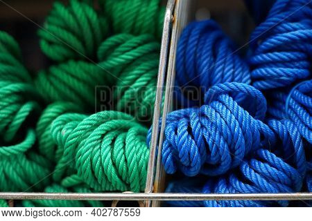 Selective Focus Of Texture Nylon Rope Blue And Green Color Wire On Shelf