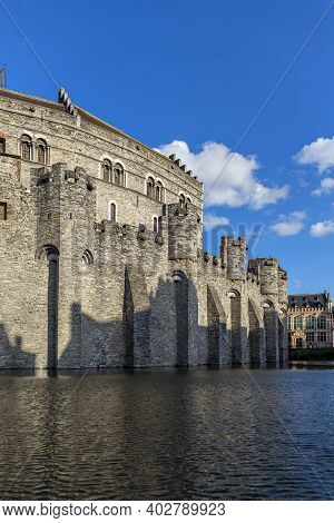 Castle Of Ghent (gand) Mirroring In The Water (belgium)