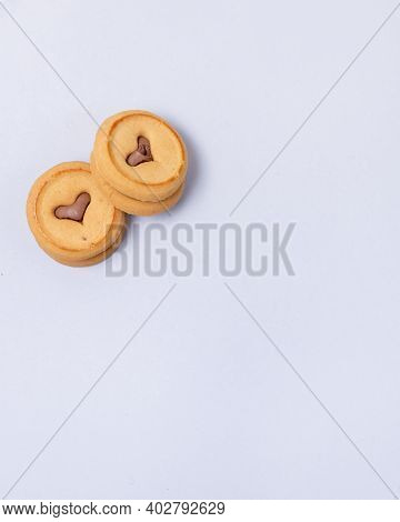 Homemade Cookies With Heart Shape Chocolate Window On Blue Background Copy Space