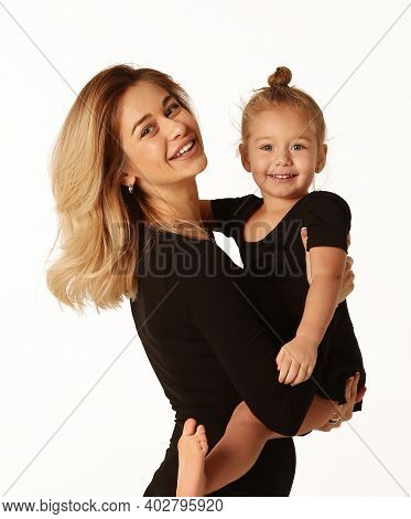 Girl And Mom In Black Body Having Fun Cuddle Close Up Studio Portrait Isolated On White