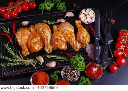 Marinated Chicken Dramstick On A Grill Pan With Spices For Cooking.ogranic Food And Healthy Eating C