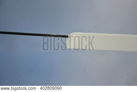 Power Lines Frozen By A Large Layer Of Ice In The Shape Of A Cylinder With Icicles. Icing Loads The 