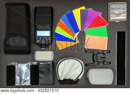 The Full Set Of Speedlight Over The Dark Background. Close Up. Flat Lay. Directly Above, High Angle 