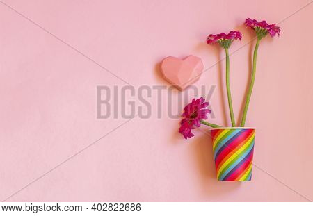 Valentines Day. Paper Cup Rainbow And Gerbera ,heart On Soft Pink Background. The Concept Of Gay Pri