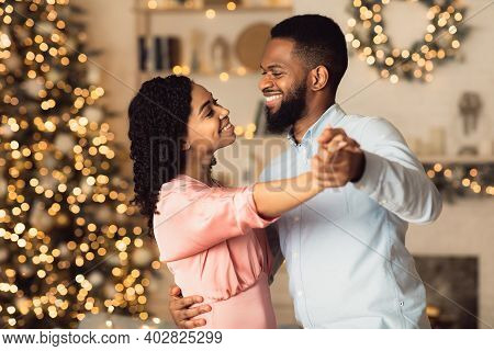 Love And Affection. Portrait Of Beautiful Millennial Black Couple Dancing And Looking At Each Other.