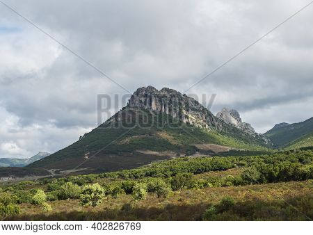 Landscape With View Of Limestone Mountain Monte Oseli, Green Forest, Trees And Hills In Region Oglia