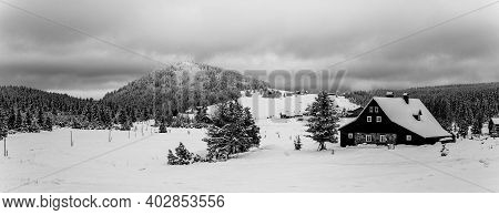 Jizerka Village And Bukovec Mounain In Winter. Jizera Mountains, Czech Republic. Black And White Ima