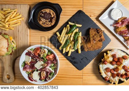 Set Of Restaurant Food On A Wood Background, Top View.