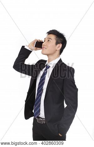 Portrait Of A Businessman Standing With Cellular Phono High Quality Photo