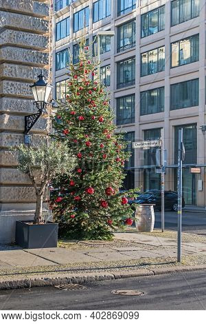 Berlin, Germany - December 18, 2020: Christmas Tree Decorated With Red Balls At The Street Behrenstr