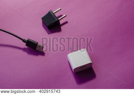 Black And White Interchangeable Dc And Ac Plugs. Wall Adapters For U.s. And Europe And Usb Data Cabl