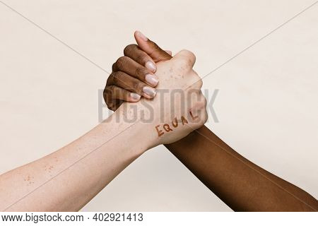 Equal word on two hands joining together background