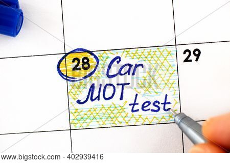 Woman Fingers With Pen Writing Reminder Car Mot Test In Calendar. Close-up