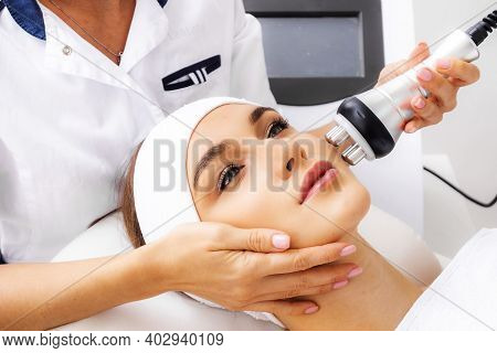 Photo Vacuum Rf Face Lifting. Biostimulation In A Beauty Salon. Skin Rejuvenation. Radio Wave Liftin