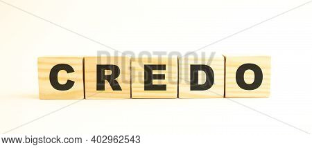 The Word Credo. Wooden Cubes With Letters Isolated On White Background. Conceptual Image.