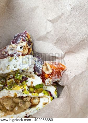 Rahat Lakoum In Paper Bag. Traditional Turkish Dessert. Sweet Snack Food. Vertical Mobile Traveling 