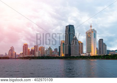 Xiamen, China skyline on Yundang Lake at twilight.