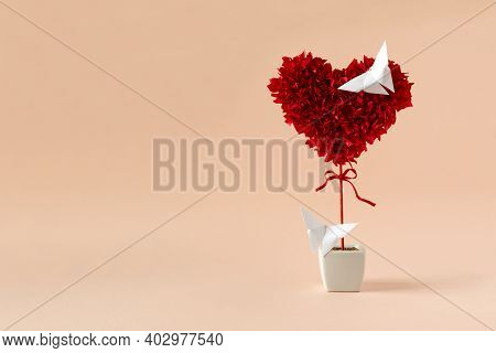Red Heart Shape Made Of Papers With Butteflies On Pink Background. Valentines, Mothers Day And Birth