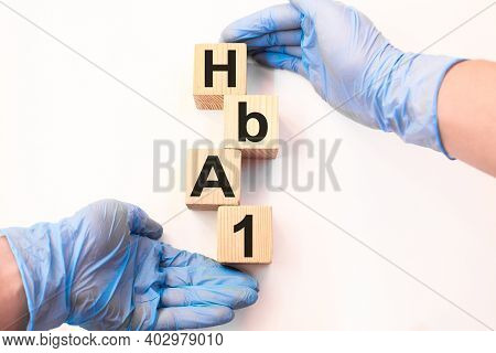 The Doctor Holds Wooden Cubes With Text Hba1. The Medicine. Medical Concept